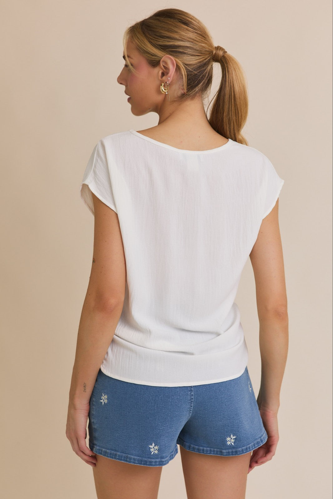 Short Sleeve Top With Twist Hem Detail
